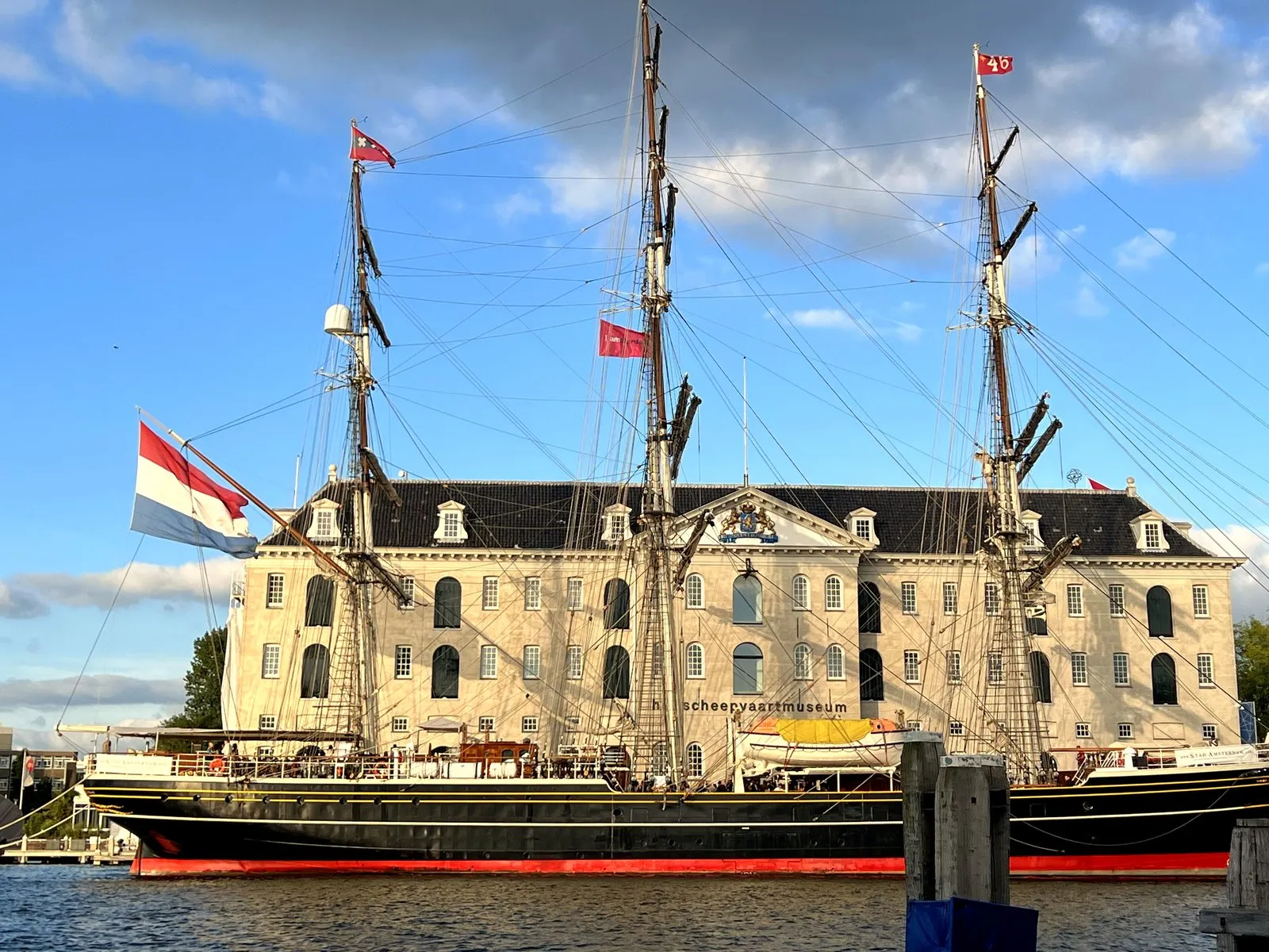 The replica tall ship moored outside the National Maritime Museum in Amsterdam