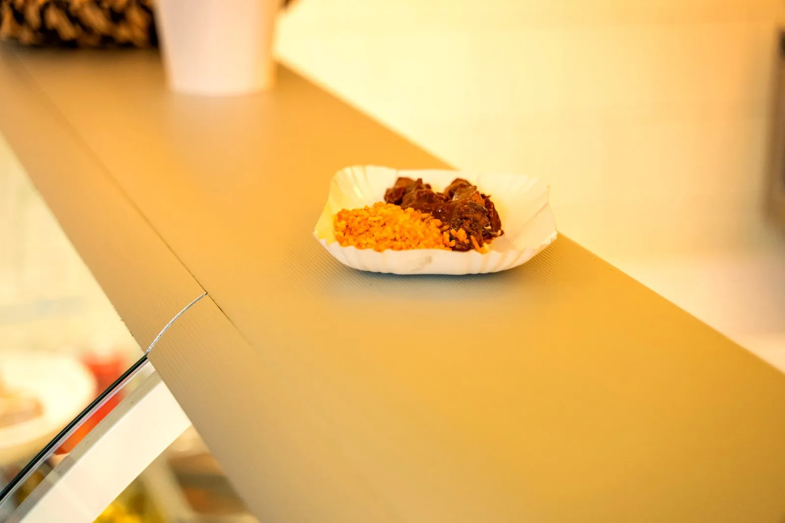 Trays of Indonesian and Surinamese dishes at the hot counter of an Amsterdam toko