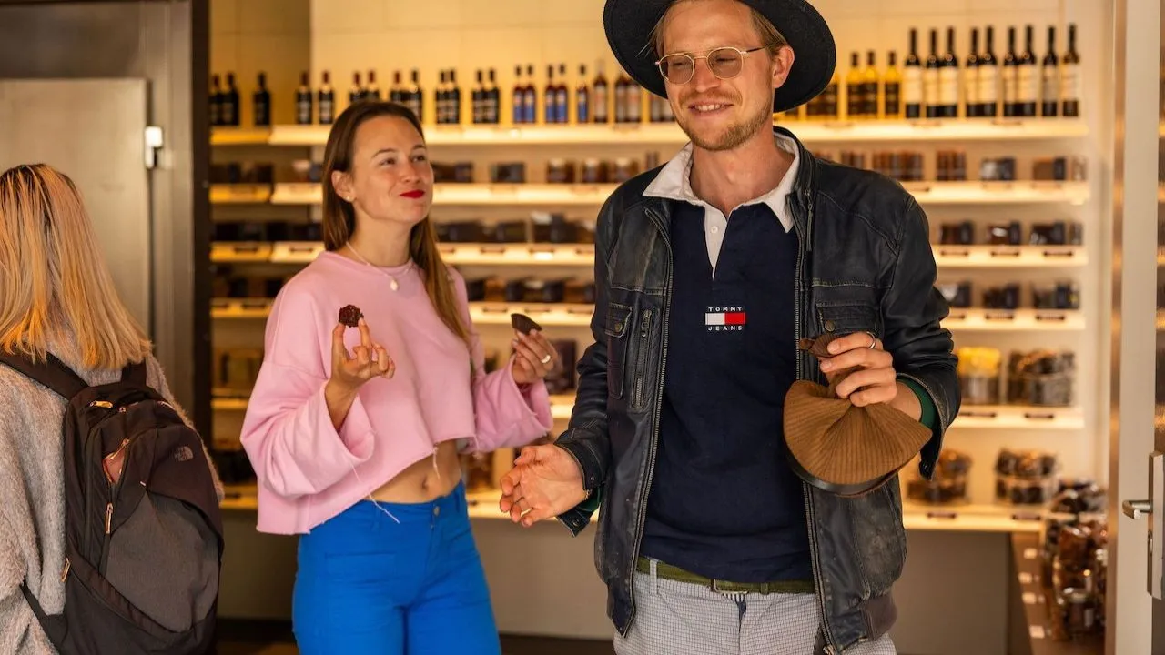 Couple tasting rich Dutch chocolate at a local Amsterdam shop