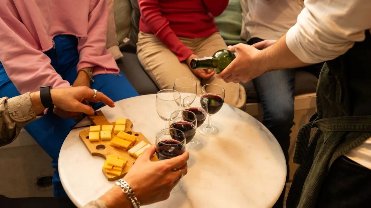 group of people enjoying the Wine and Cheese tasting session