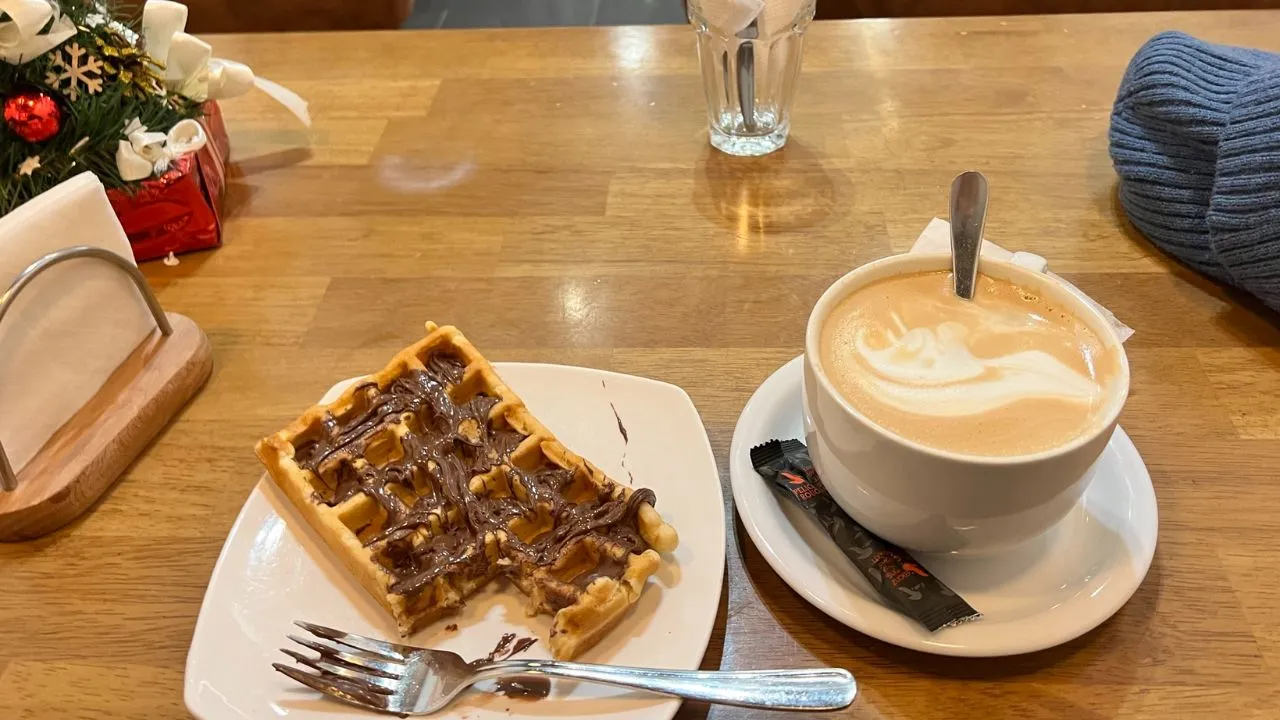 Chocolate‑Dipped Stroopwafel with coffee on the side