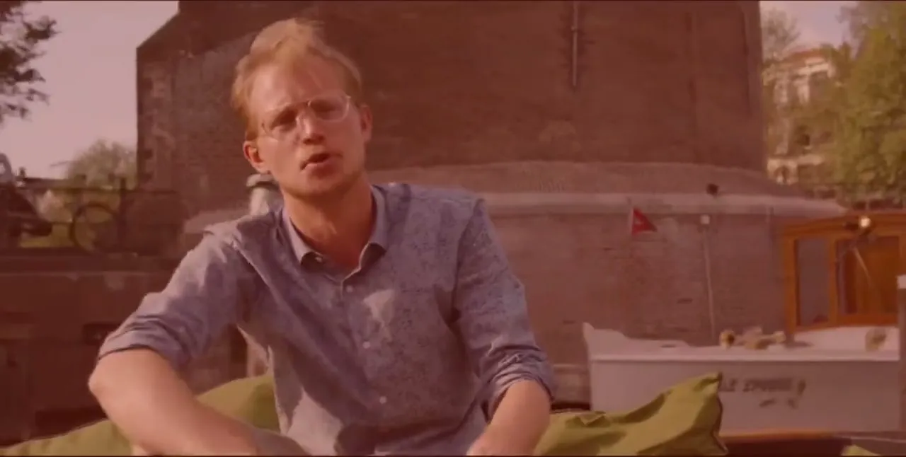 Otto on a canal boat in Amsterdam, filming for CuriosityStream's The History of Home